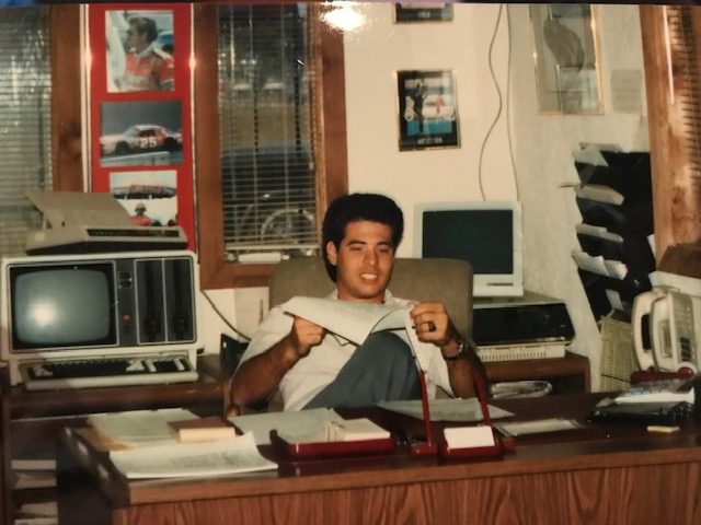 Jeffrey Beauregard at twenty-one, at his father's dealership desk
