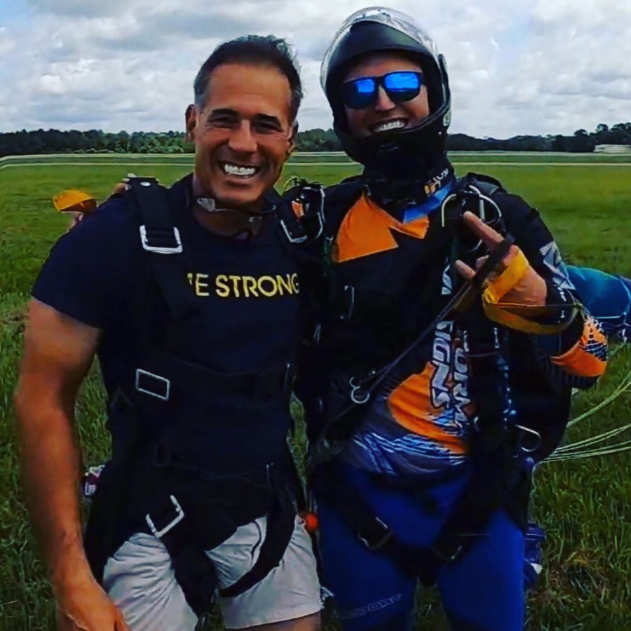Jeffrey Beauregard after a skydive, with his tandem instructor